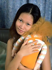 Petite asian babe opens her tight virgin pussy with a smile